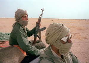 (FILES) Polisario fighters patrol near the 1600kms long, Moroccan defensive walls, 15 June 1988, in Polisario-controlled Western Sahara. The Polisario Front threatened 21 December 2007 to resume war against Morocco if the negotiations in New York 07-09 January 2008 to end the conflict fail. The Polisario front, an armed movement backed by Algeria, is fighting for the independence of Western Sahara, a former colony of Spain that was invaded and annexed by Morocco in 1975. AFP PHOTO / MIKE NELSON (Photo credit should read MIKE NELSON/AFP/Getty Images)